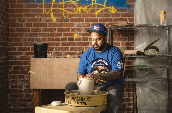 Roberto Lugo in his studio making pottery.